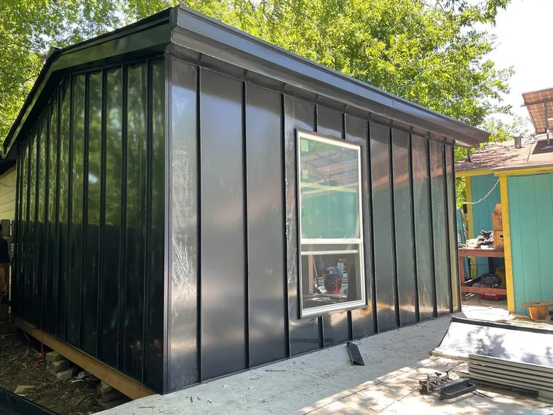 Black standing seam metal wall panels for Roof Inspection in Templeton